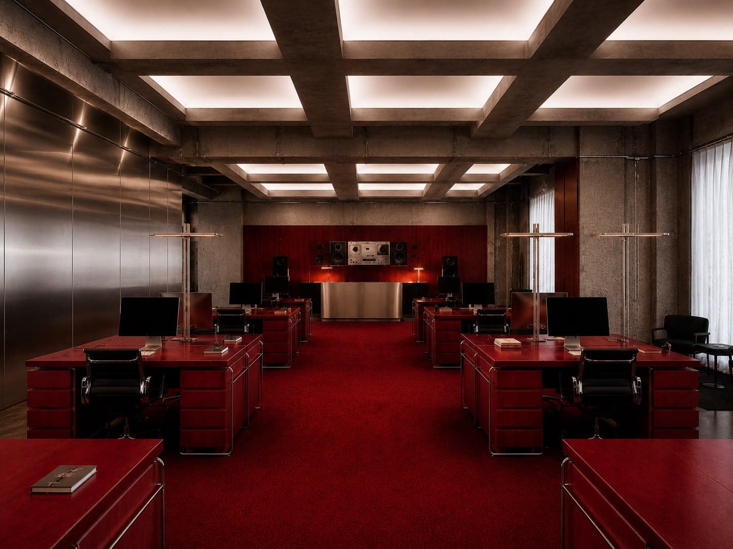 Executive office in dark wood with chrome-frame leather seating.